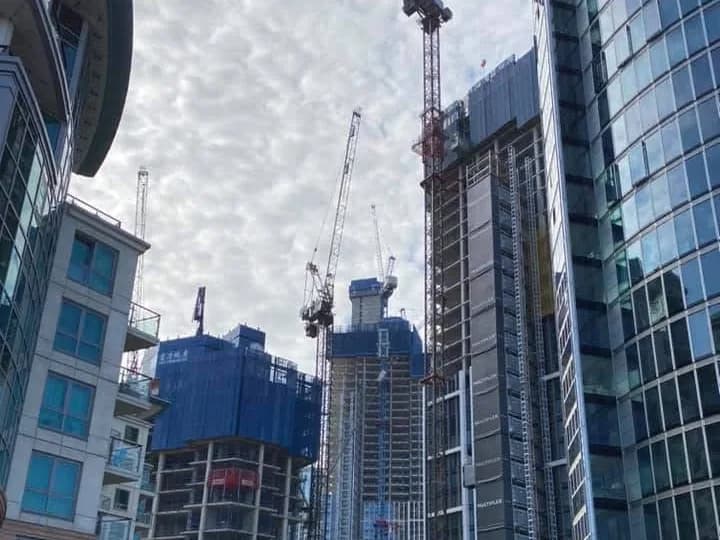 Tower cranes over high-rise blocks under construction