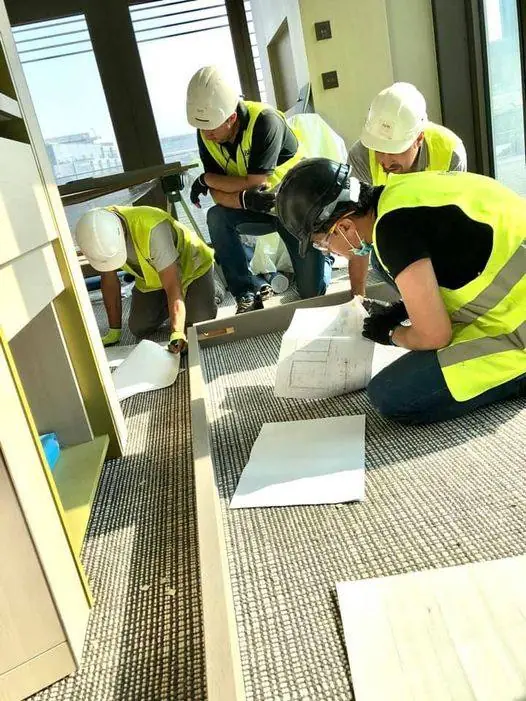 Site team working from drawings on the job